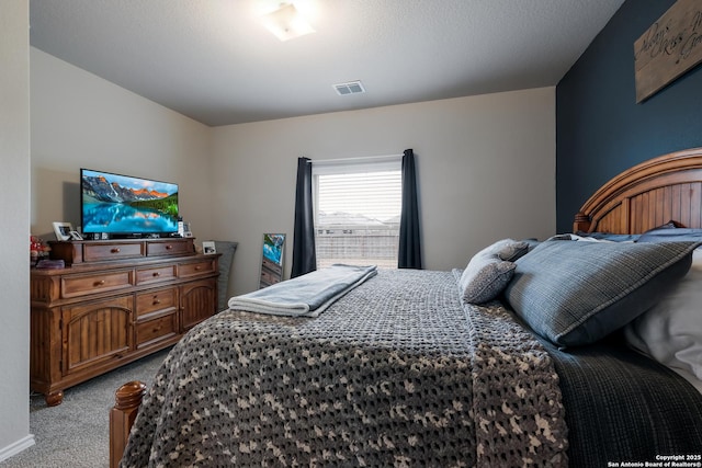 bedroom featuring light carpet