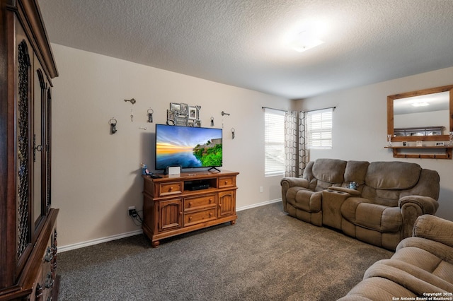 living room with a textured ceiling and dark carpet