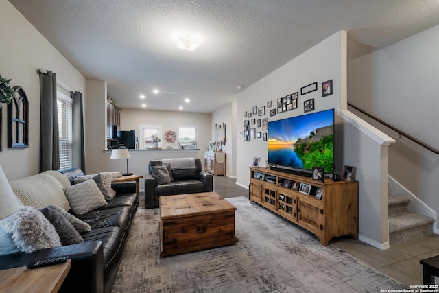 tiled living room with a textured ceiling