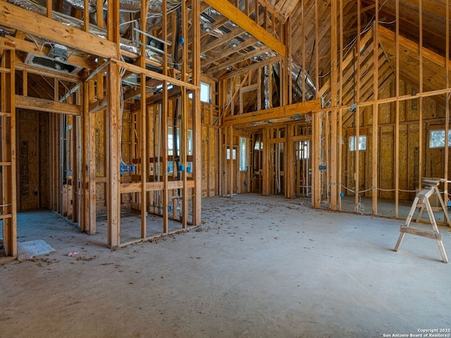 miscellaneous room with a towering ceiling