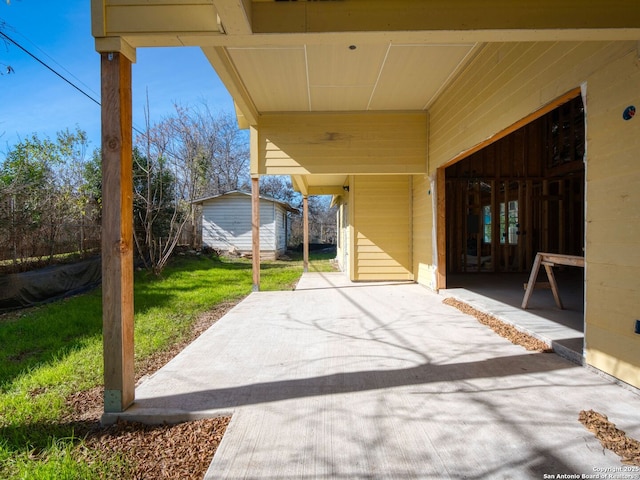 view of patio with a storage shed