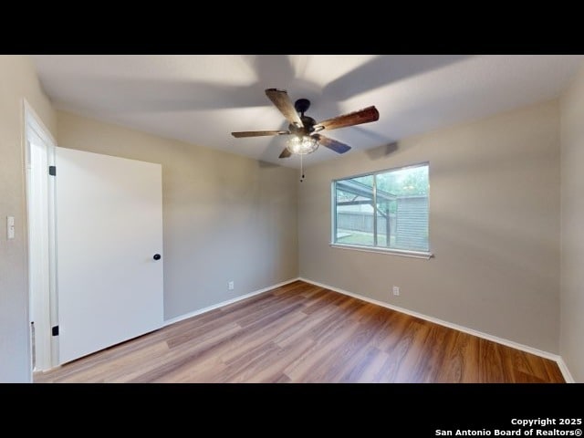 unfurnished room with light hardwood / wood-style flooring and ceiling fan