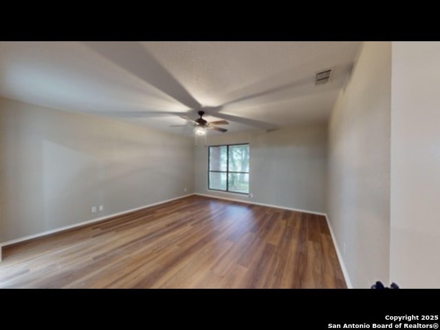 spare room featuring ceiling fan and wood-type flooring