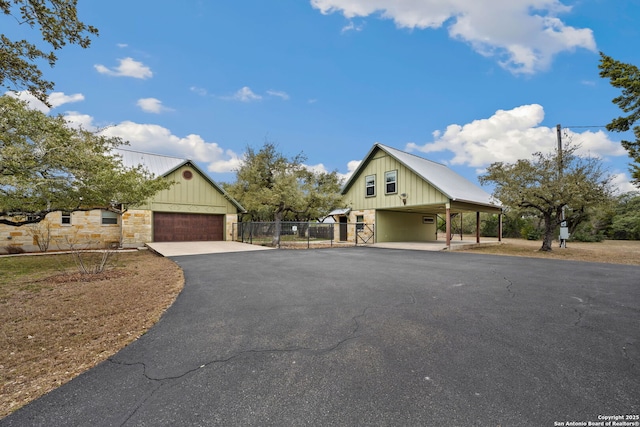 modern inspired farmhouse with a garage