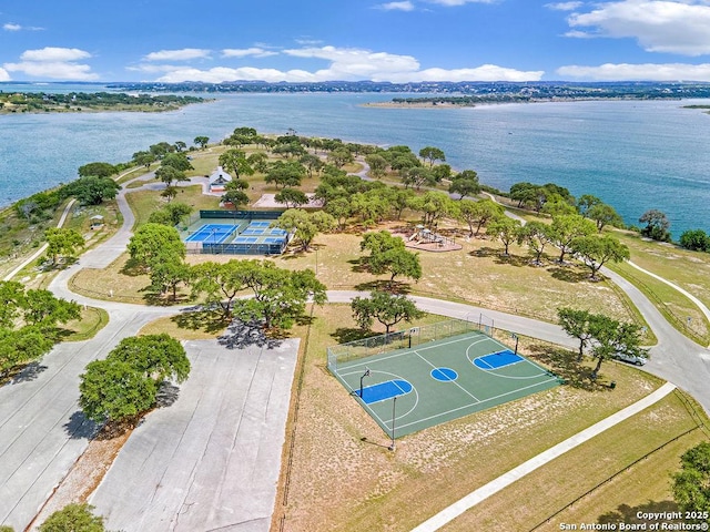 birds eye view of property with a water view