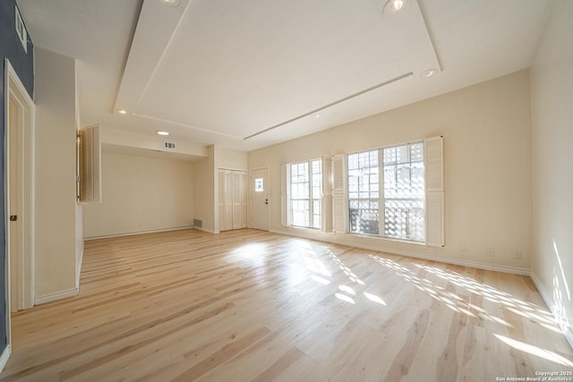 spare room featuring light hardwood / wood-style floors