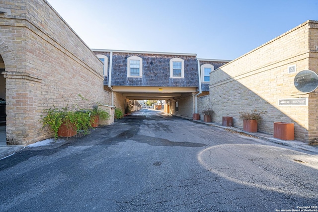 exterior space with a carport