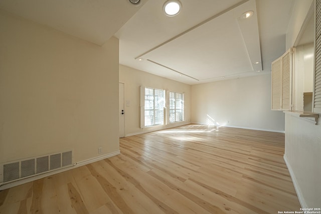 unfurnished living room featuring light hardwood / wood-style floors