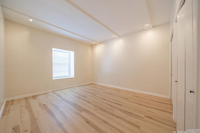 spare room with light hardwood / wood-style floors