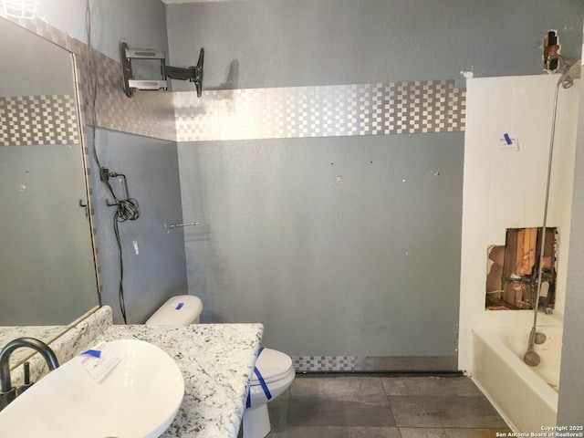 full bathroom with vanity, toilet, and  shower combination