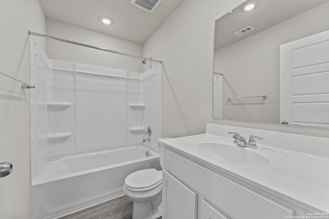 full bathroom with vanity, washtub / shower combination, toilet, and wood-type flooring