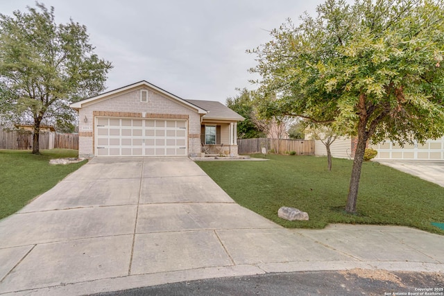 ranch-style house featuring a garage and a front yard