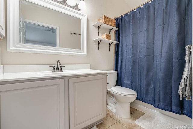 full bathroom featuring toilet, vanity, shower / bath combo, and tile patterned flooring