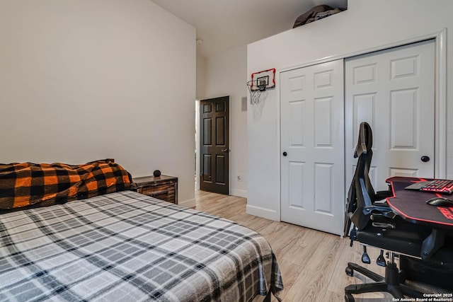 bedroom featuring light hardwood / wood-style floors and a closet