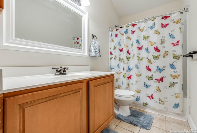 full bathroom with shower / bath combination with curtain, toilet, vanity, and tile patterned flooring