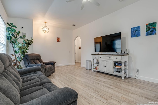 living room with ceiling fan and light hardwood / wood-style floors