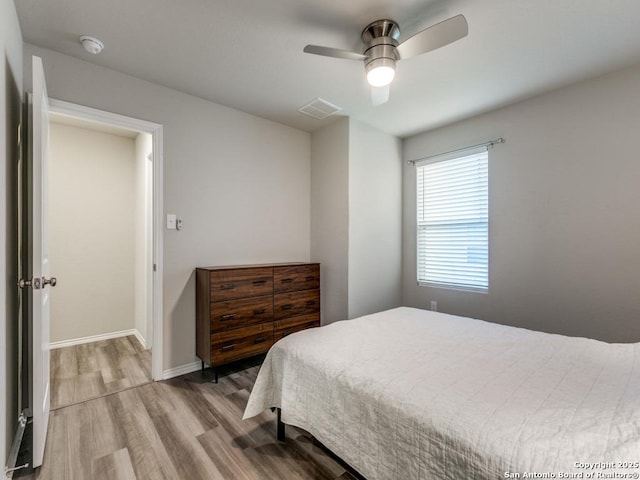 bedroom featuring wood-type flooring and ceiling fan