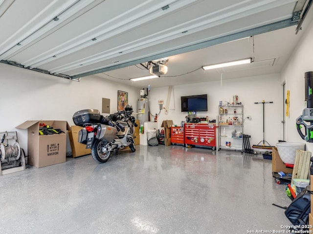 garage with a garage door opener, electric panel, and water heater