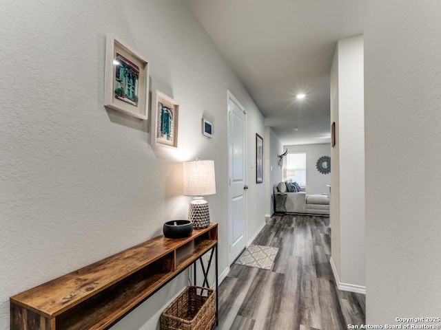 corridor with dark hardwood / wood-style floors