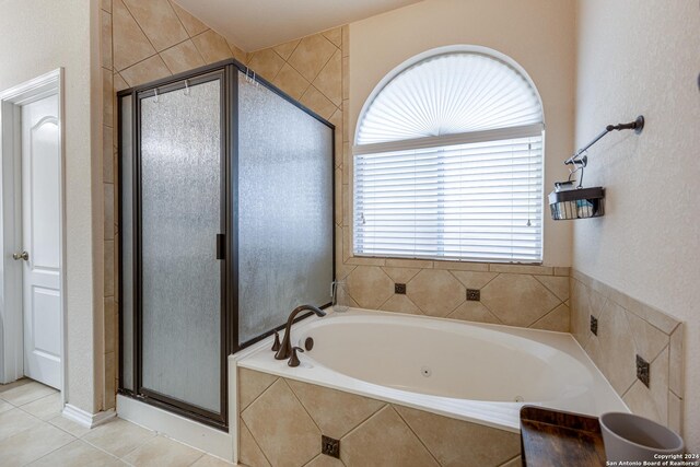 bathroom featuring separate shower and tub and tile patterned flooring