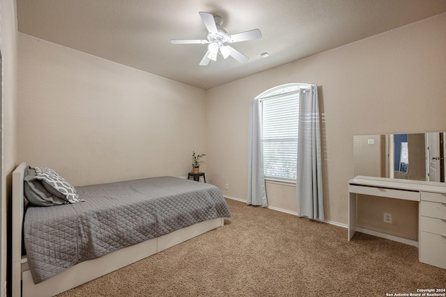 bedroom with light colored carpet and ceiling fan