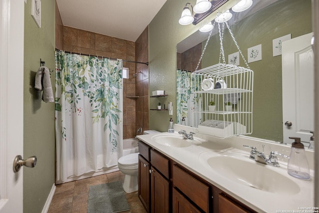 full bathroom with vanity, toilet, and shower / tub combo with curtain