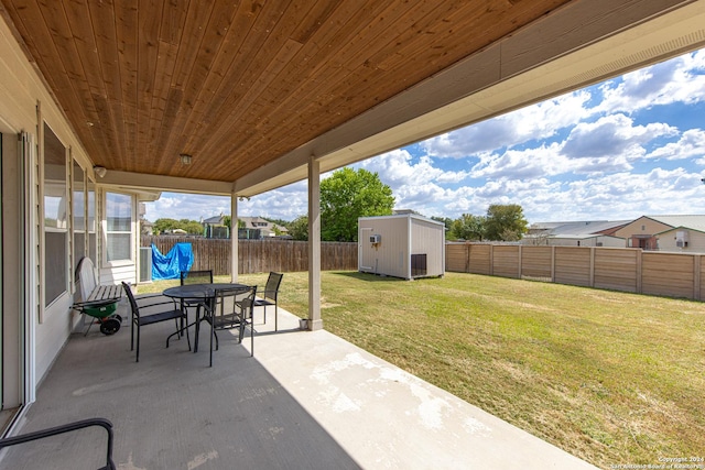 view of patio / terrace with a storage shed