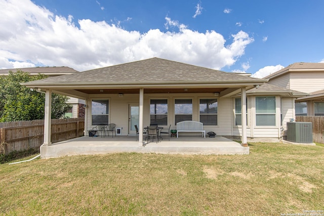 back of house with a patio, central AC, and a yard