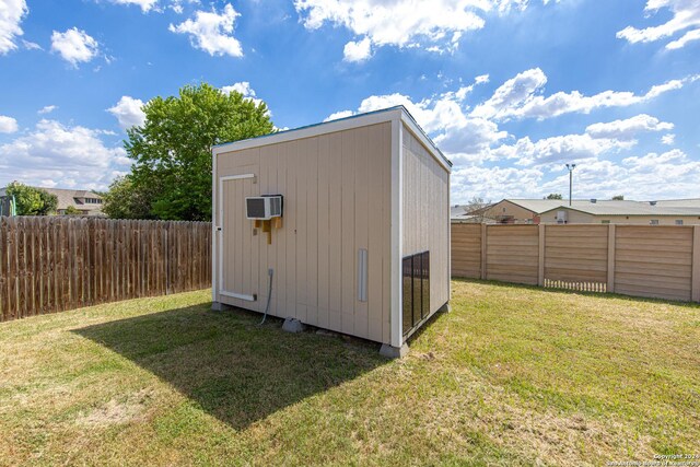 view of outdoor structure with a lawn