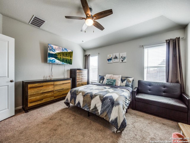 bedroom featuring ceiling fan, carpet, and vaulted ceiling