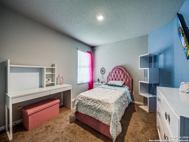 carpeted bedroom featuring a textured ceiling