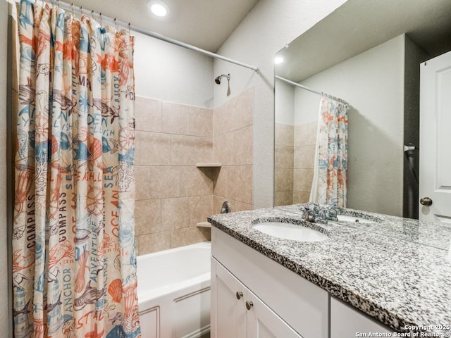 bathroom featuring vanity and shower / tub combo