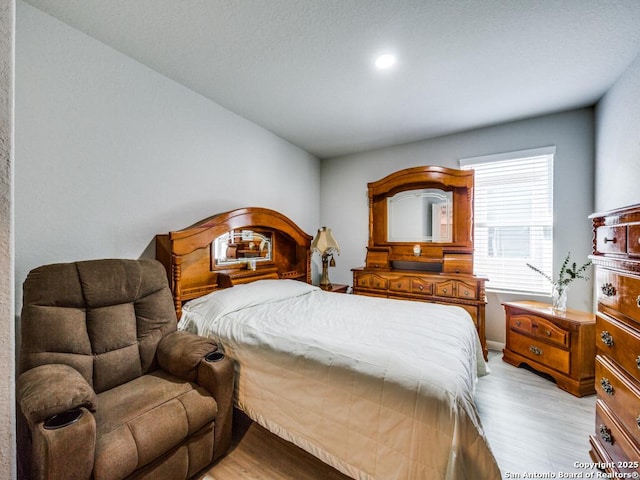 bedroom with light hardwood / wood-style flooring