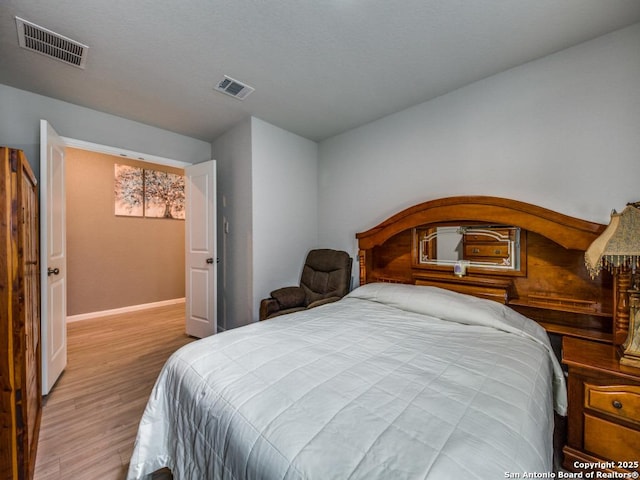 bedroom featuring light hardwood / wood-style floors