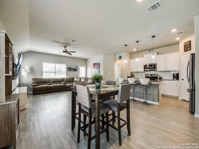 dining room featuring ceiling fan and light wood-type flooring