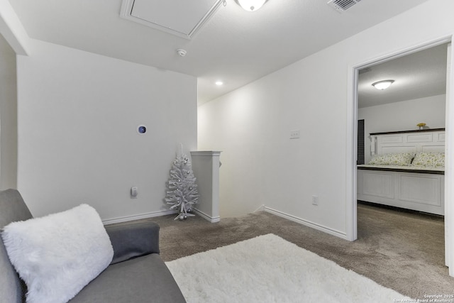 living area with dark colored carpet