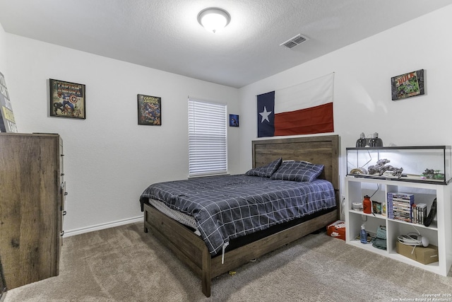 carpeted bedroom with a textured ceiling