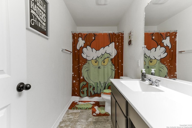 bathroom featuring vanity, toilet, and a shower with curtain