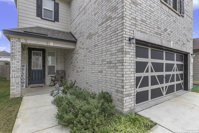 doorway to property featuring a garage