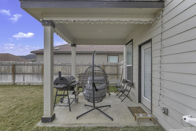 view of patio featuring a grill