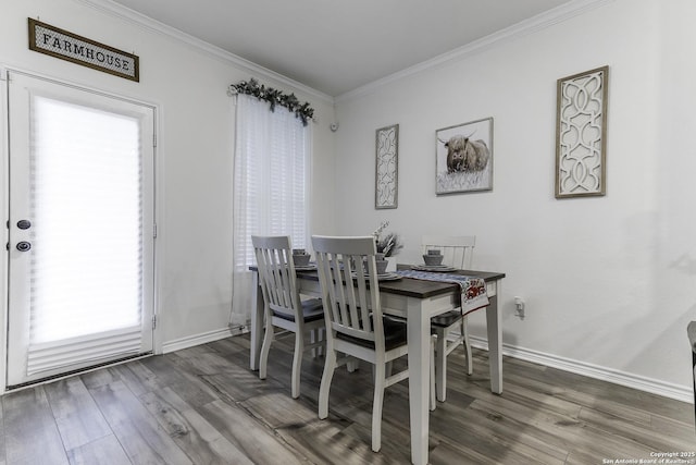 dining area featuring wood-type flooring and crown molding