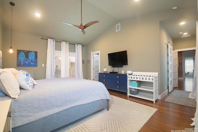 bedroom with ceiling fan, dark hardwood / wood-style flooring, and vaulted ceiling