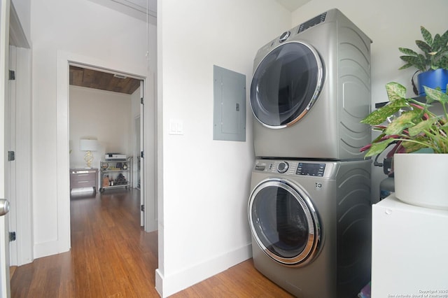 washroom with wood ceiling, stacked washer / drying machine, electric panel, and hardwood / wood-style floors