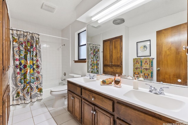 full bathroom with a textured ceiling, tile patterned flooring, vanity, toilet, and shower / bath combo with shower curtain