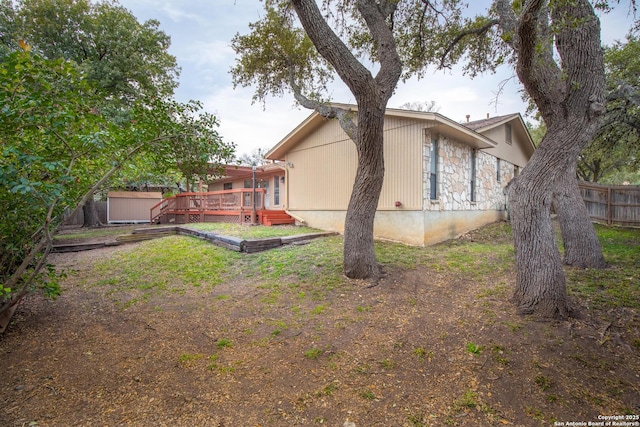 view of yard with a wooden deck