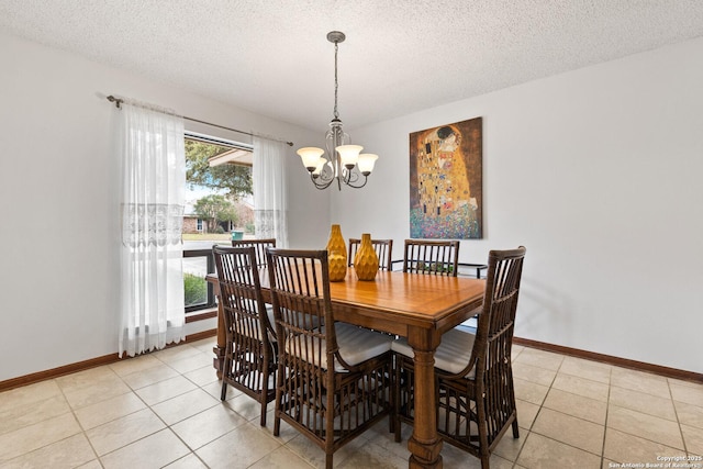 tiled dining room featuring a textured ceiling and a notable chandelier