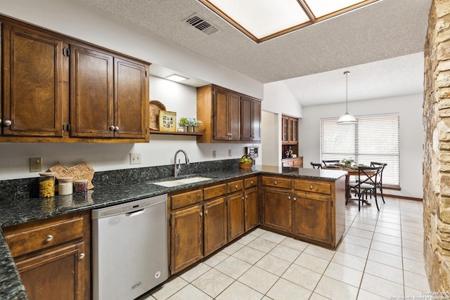 kitchen featuring a textured ceiling, decorative light fixtures, sink, kitchen peninsula, and stainless steel dishwasher