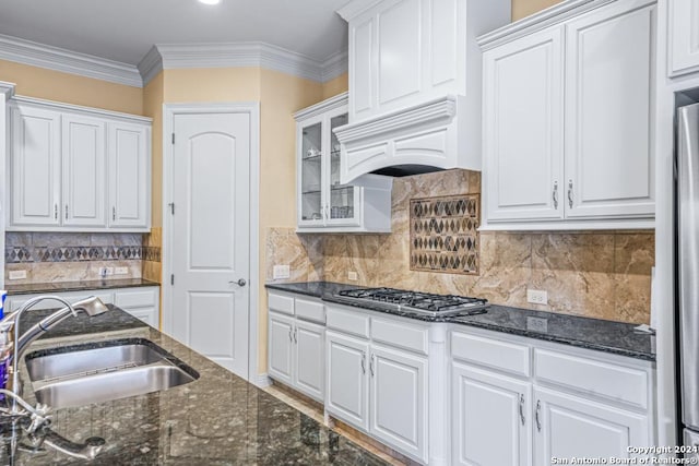 kitchen featuring sink, white cabinetry, appliances with stainless steel finishes, and custom range hood