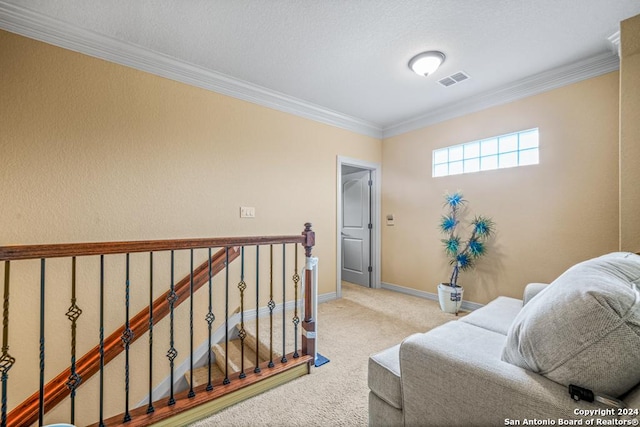 sitting room featuring crown molding and light colored carpet