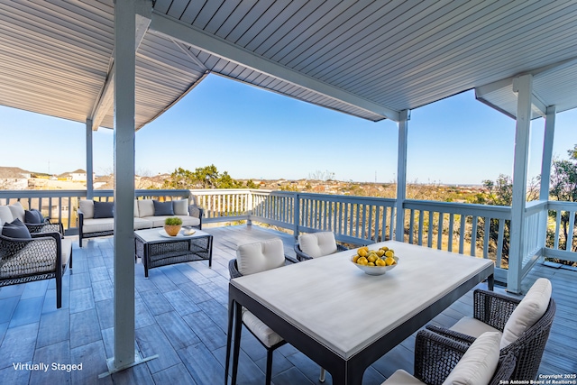 wooden deck with a patio and an outdoor hangout area